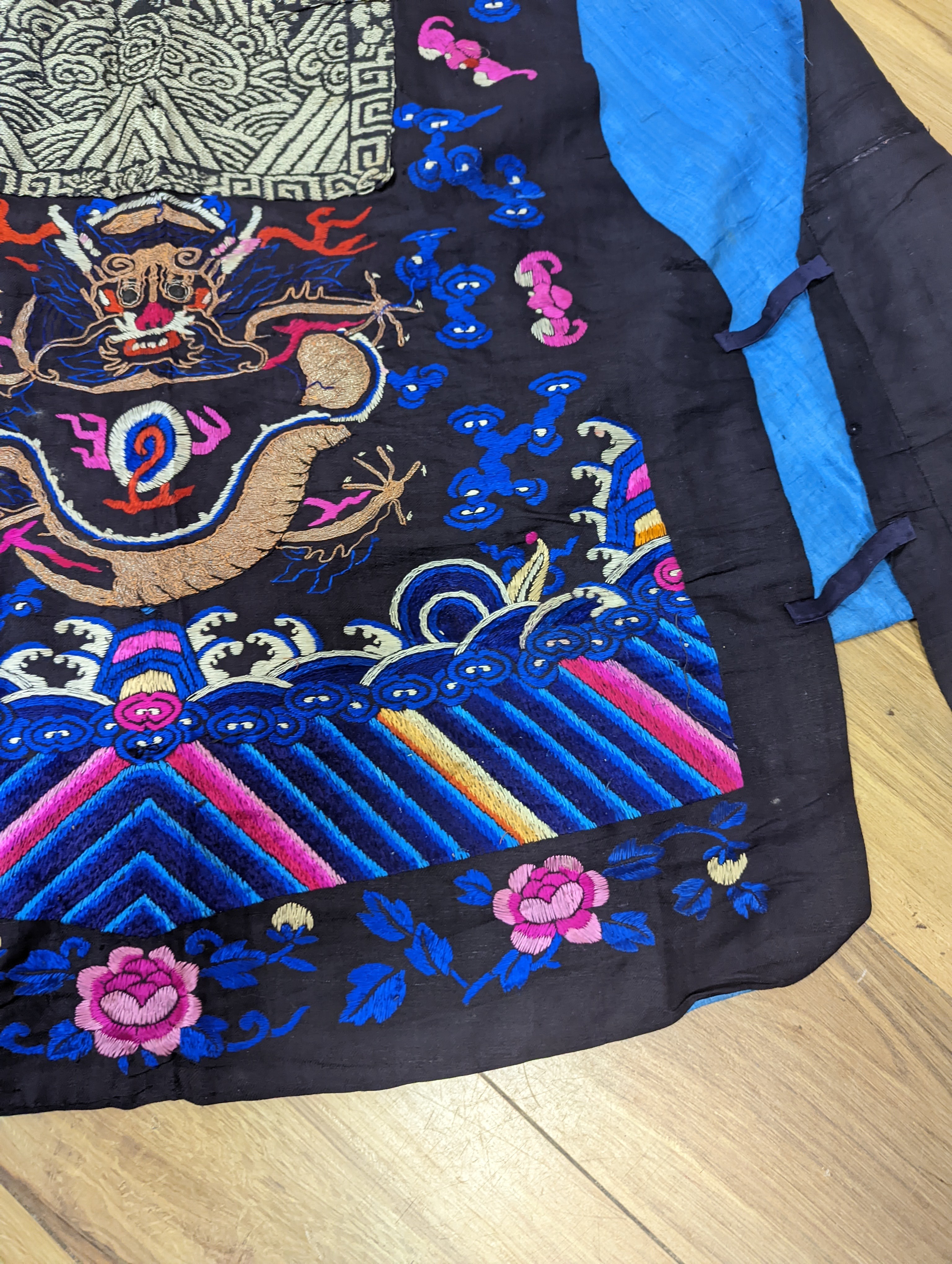 A 1920's Chinese dragon embroidered waistcoat, a cream silk drawn thread dress and a silk crepe black and patterned reversible kimono (3 items).